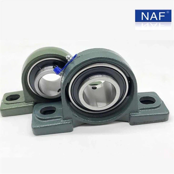 What materials are NAF pillow block bearings typically made from?